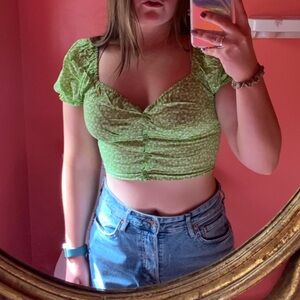 Princess Polly. Green crop top with white floral print.